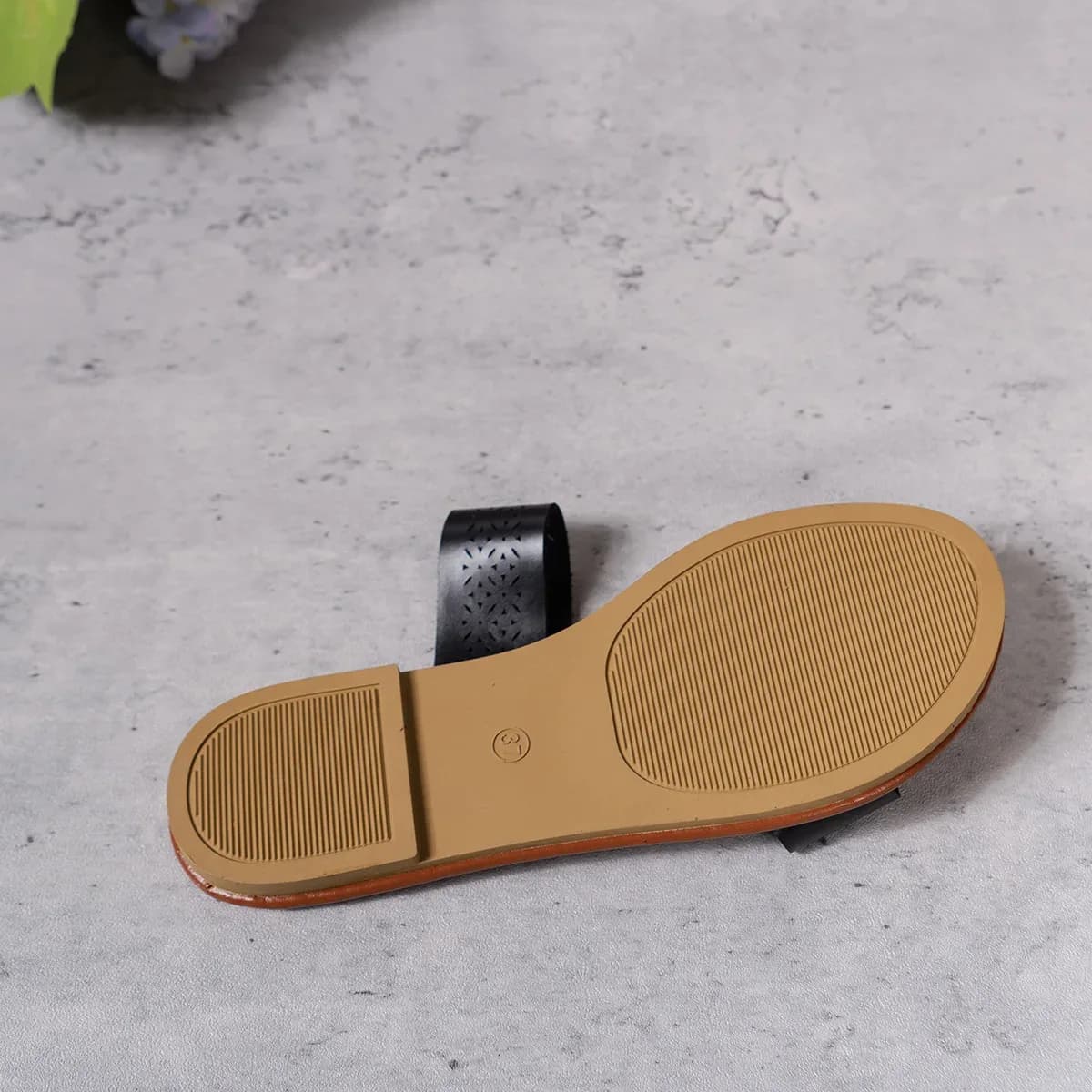 textured non-slip sole of the flat slide sandals
