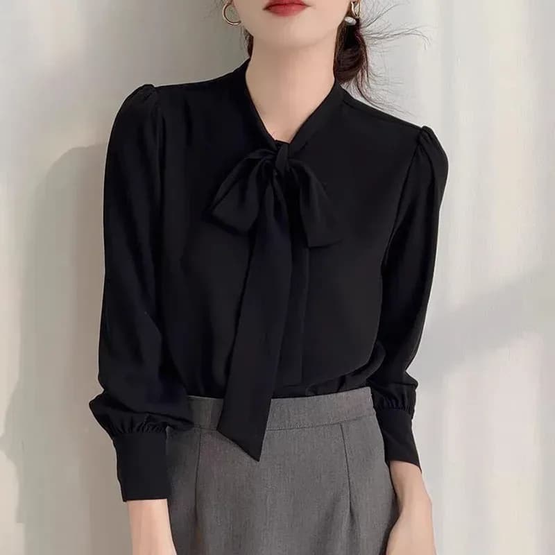 black satin tie neck bow blouse with grey trousers