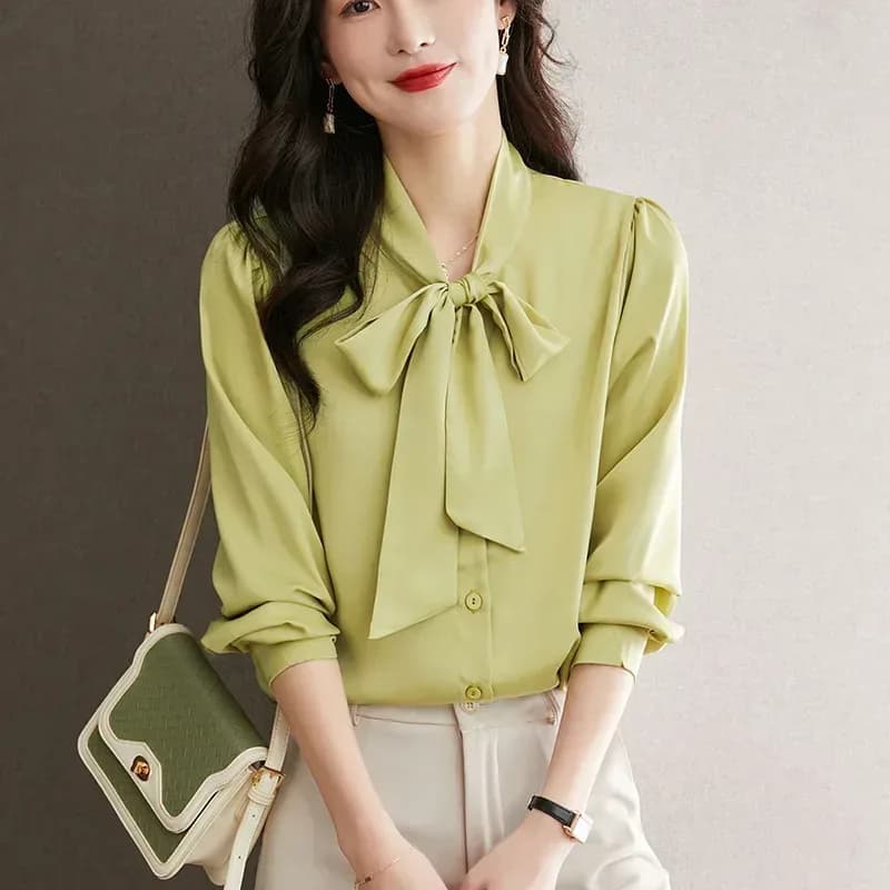 lime yellow satin tie neck bow blouse with white trousers