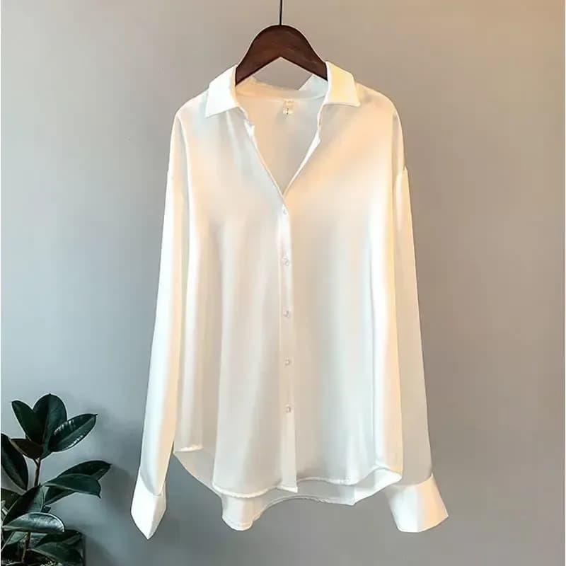 white oversized satin button down shirt with curved hem