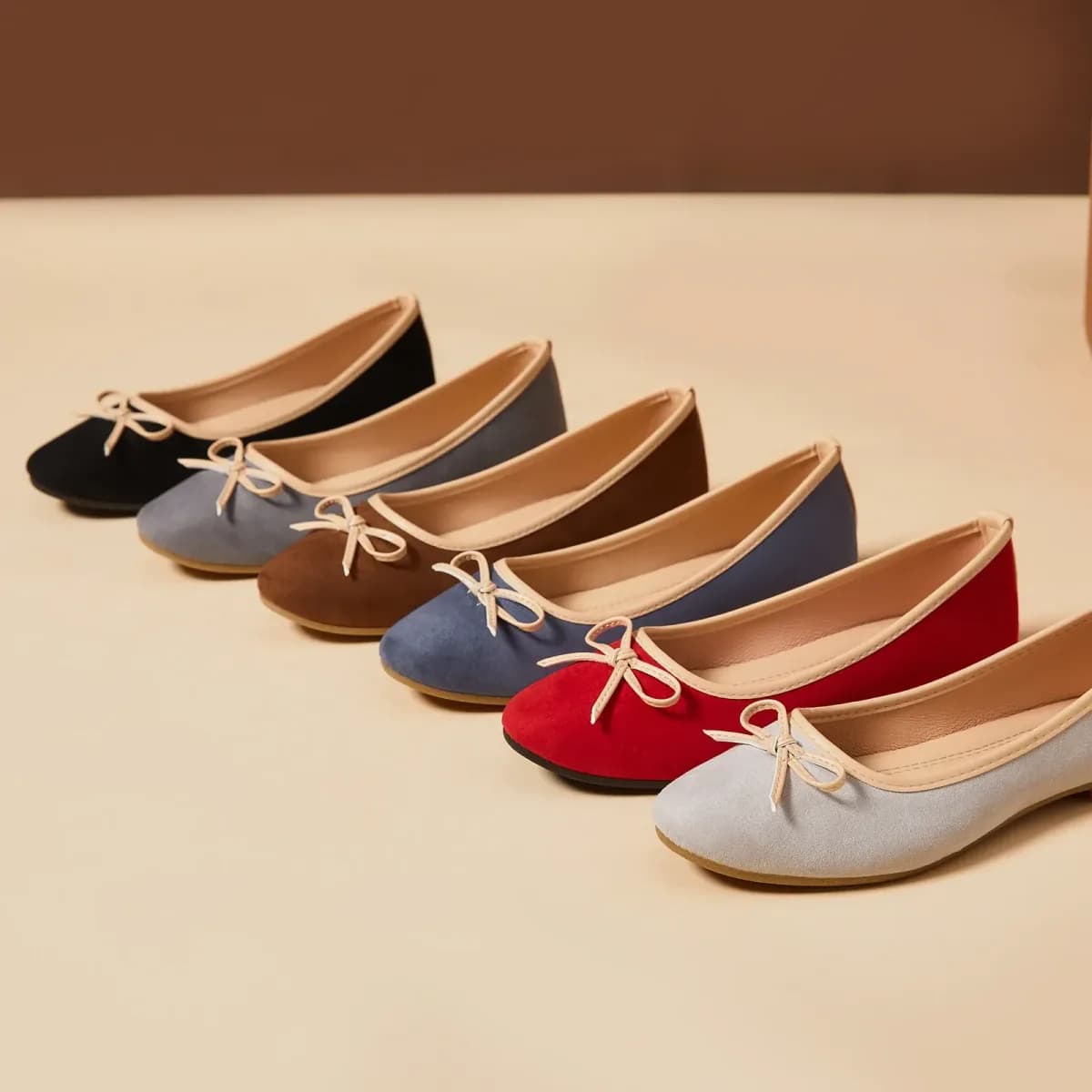 women's bow ballet flats lined up in six colors