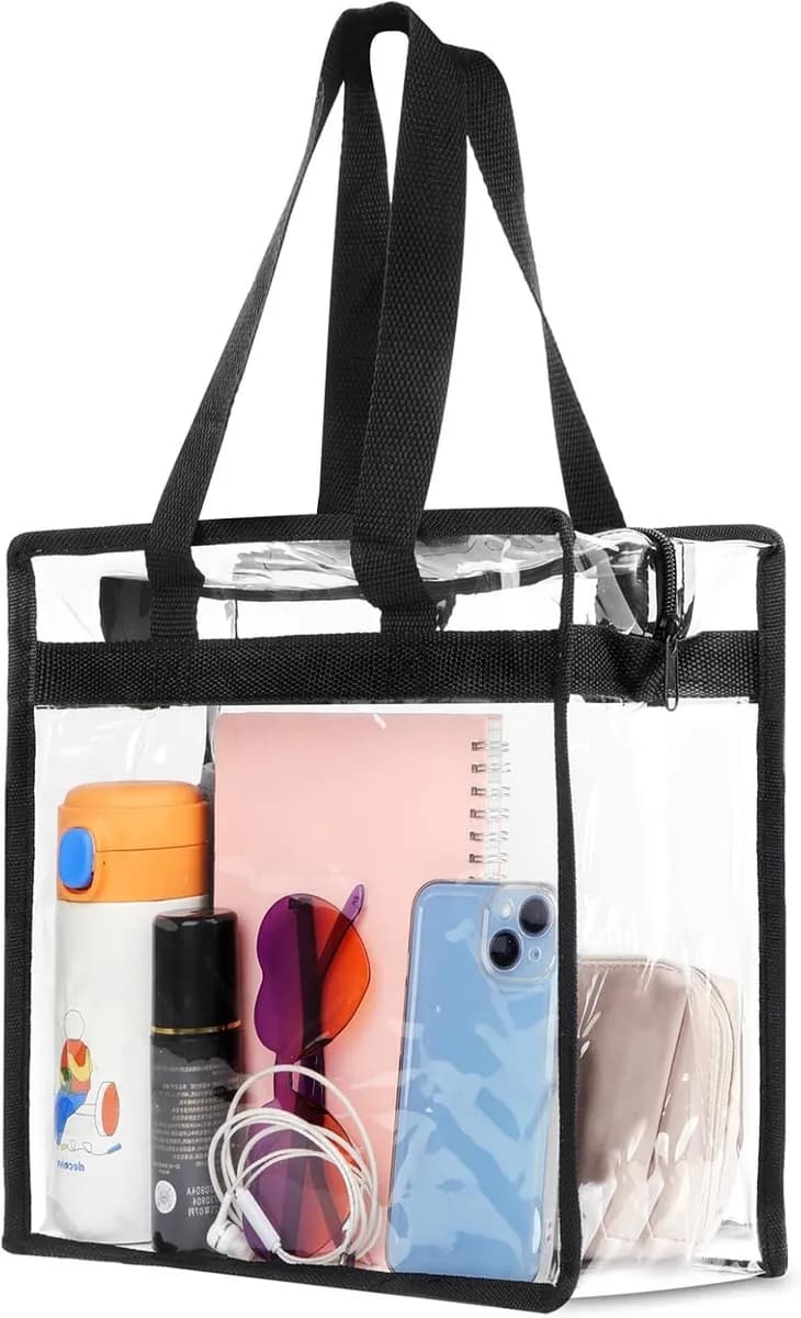 clear stadium tote bag with black trim holding a bottle, phone and notebook