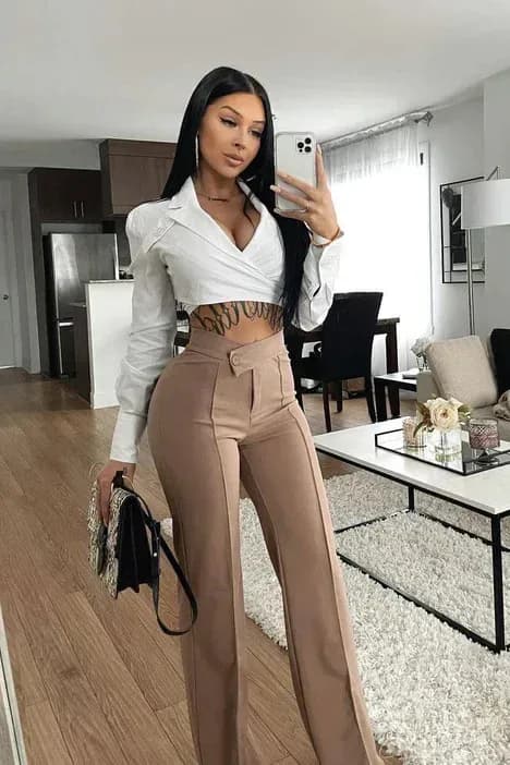 woman wearing khaki straight leg dress pants with a white shirt