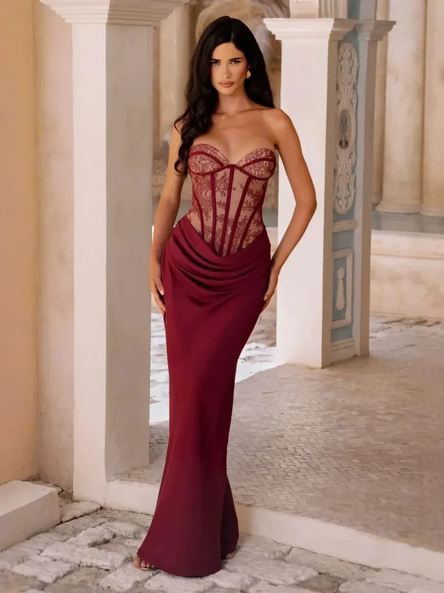 woman wearing a wine red lace corset satin mermaid maxi dress